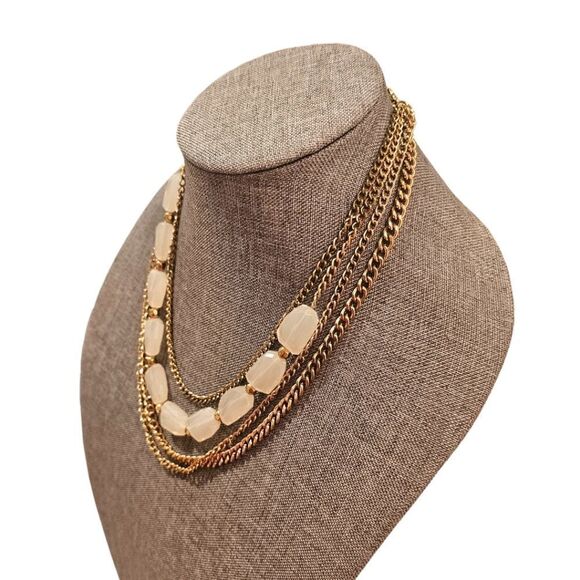 Sophia's Golden Elegance: A Four-Layered White Stone Bead Statement Necklace - Picture 7 of 10